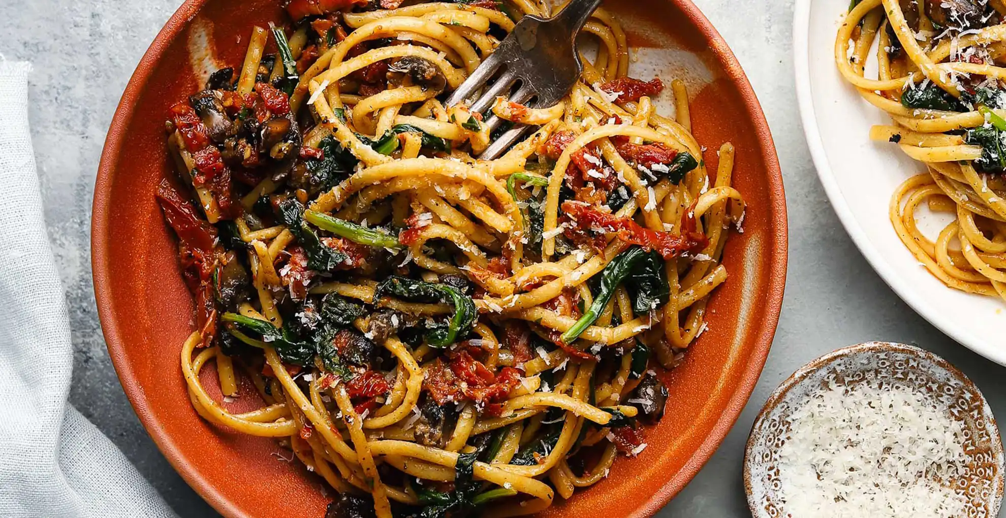 sundried mushroom pasta on plate with fork