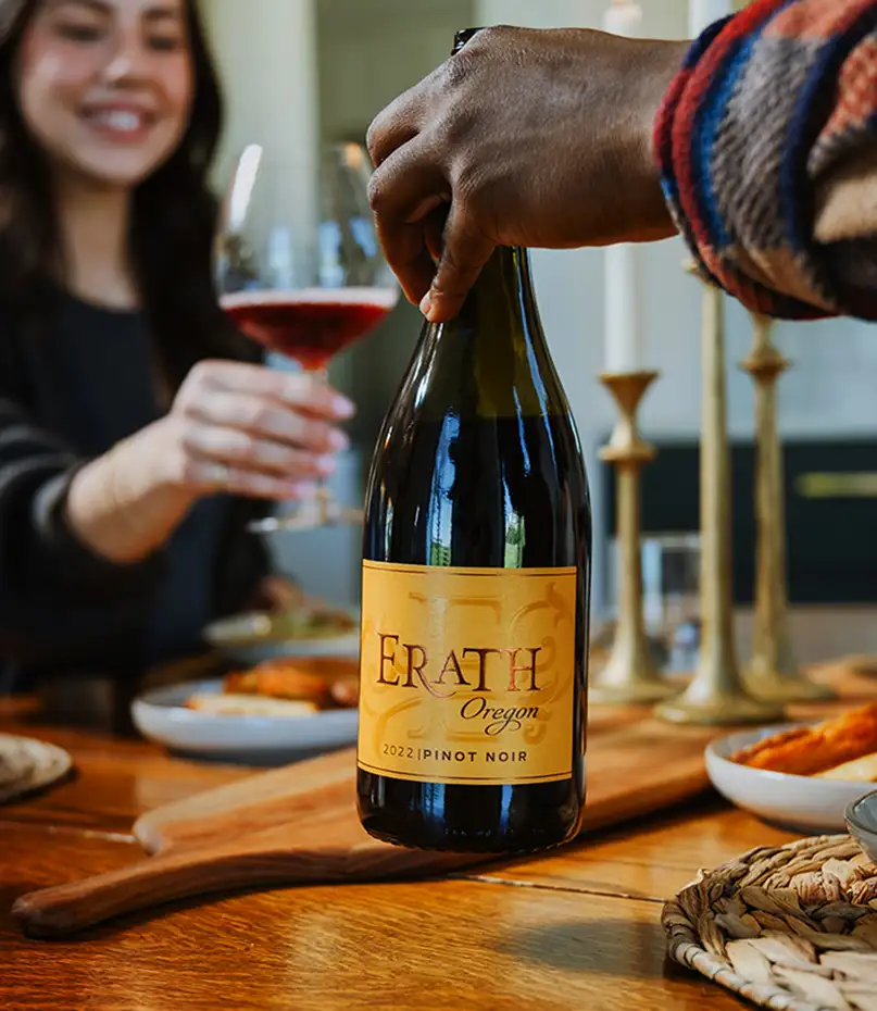 Two people enjoying Erath wines over dinner.