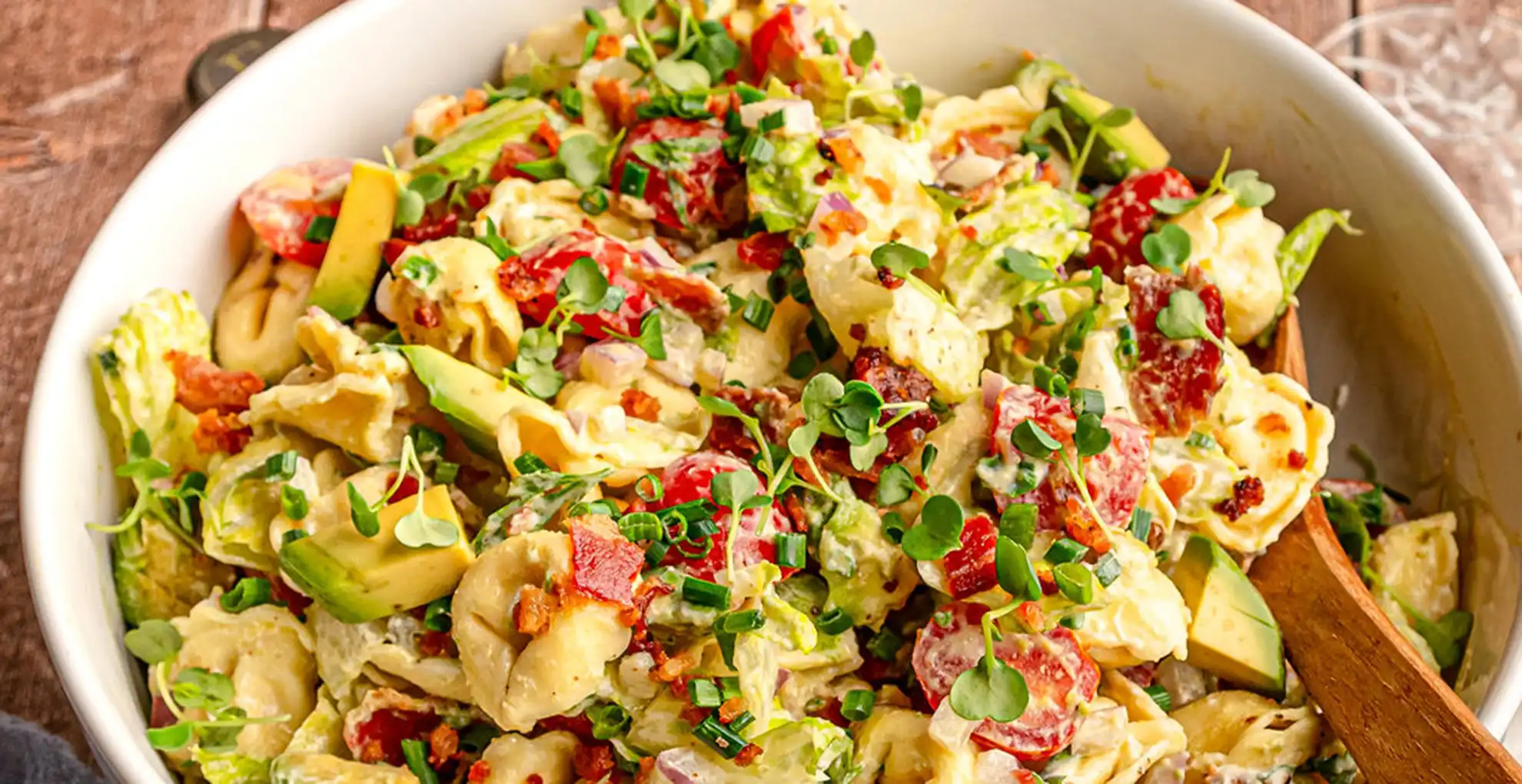 BLT Tortellini Pasta Salad in bowl with spoon