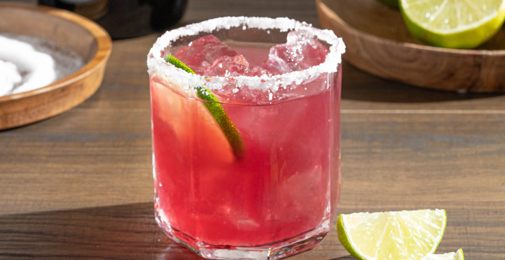 cup of pinot noir margarita with a lime next to it
