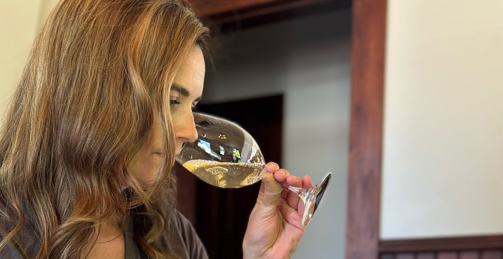 head winemaker leah smelling wine