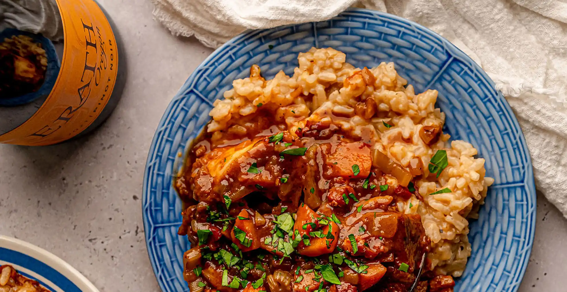 osso buco on plate with erath oregon pinot noir bottle