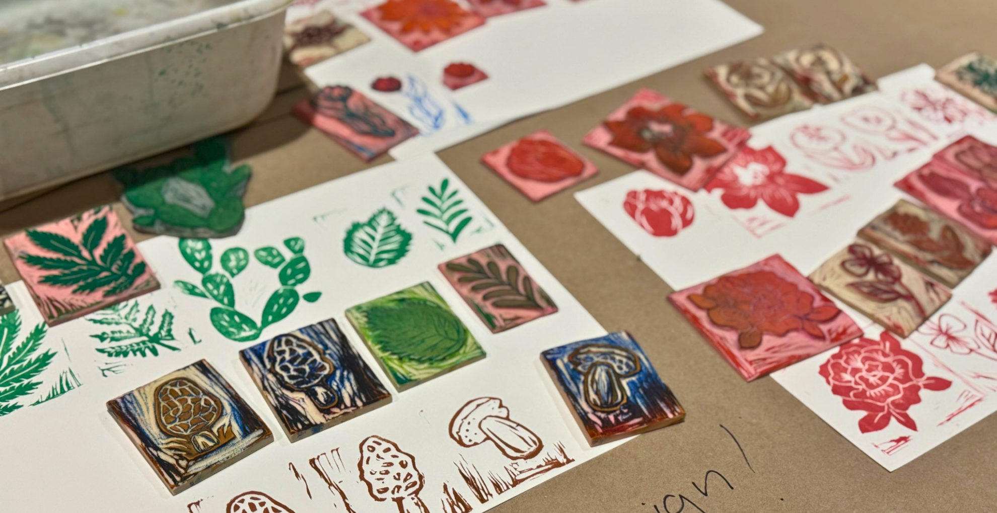 Sample stamp options for a craft are displayed on a table